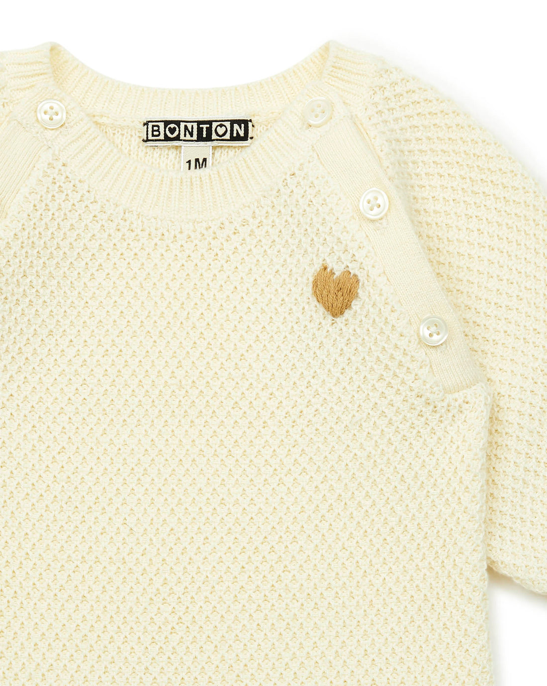 baby onesie creme