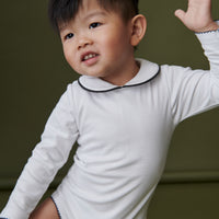 baby lirio onesie white
